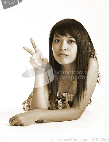 Image of young asian peace girl