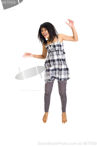Image of Young asian girl jumping for joy