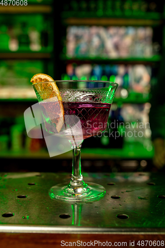 Image of Close up of alcoholic cocktail, beverage, drink in multicolored neon light