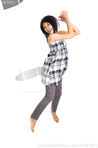 Image of Young asian girl jumping for joy