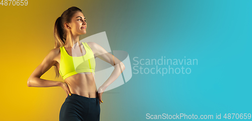 Image of Fashion portrait of young fit and sportive woman on gradient background. Perfect body ready for summertime. Flyer with copyspace.