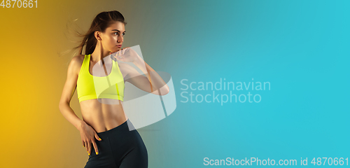 Image of Fashion portrait of young fit and sportive woman on gradient background. Perfect body ready for summertime. Flyer with copyspace.