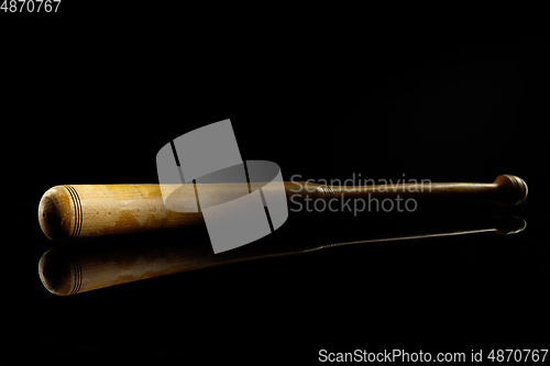 Image of Professional sport equipment isolated on black studio background. Baseball bat.