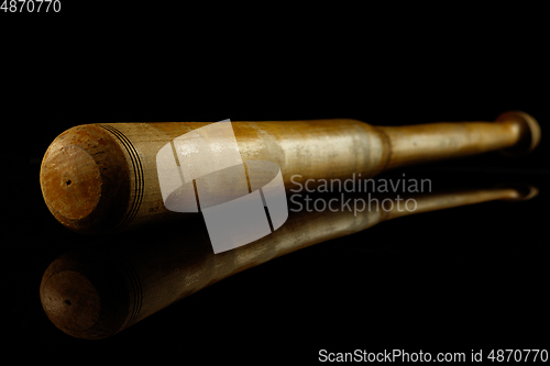 Image of Professional sport equipment isolated on black studio background. Baseball bat.