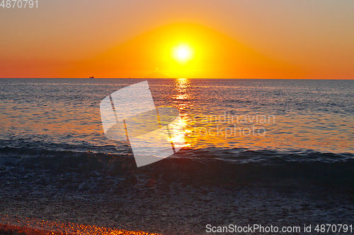 Image of Red sunset over the sea. Beautiful sunset.