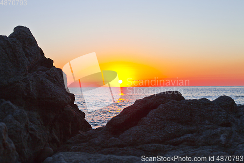 Image of Sunset on the rocky shore. Tyrrhenian Sea.