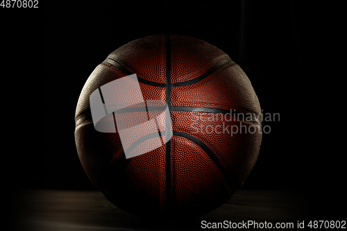 Image of Professional sport equipment isolated on black studio background. Basketball ball.