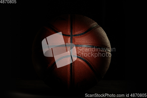 Image of Professional sport equipment isolated on black studio background. Basketball ball.