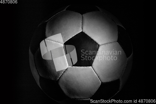 Image of Professional sport equipment isolated on black studio background. Soccer ball.