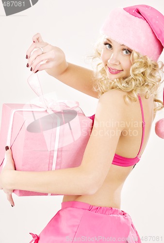 Image of cheerful santa helper girl with gift box
