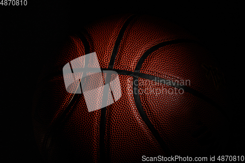 Image of Professional sport equipment isolated on black studio background. Basketball ball.