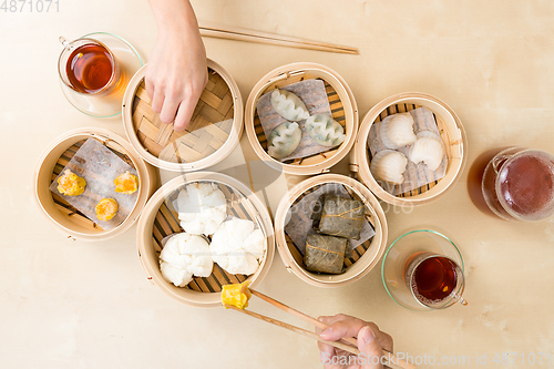 Image of Top view of people eating dim sum