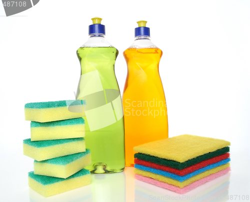 Image of Bottles of dishwashing liquid and sponges