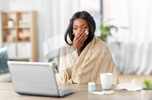 Image of sick woman having video call on laptop at home