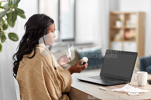 Image of sick woman having video call on laptop at home