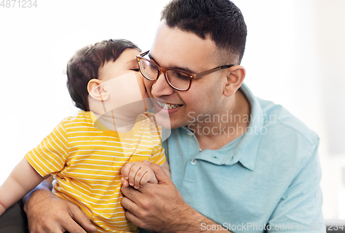 Image of happy father with little baby son at home