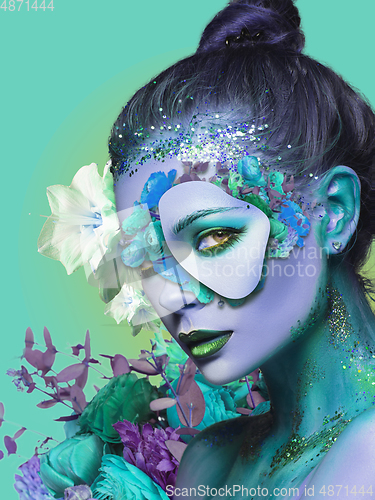 Image of Portrait of beautiful young woman with modern floral design, inspiration artwork. Fashion, beauty concept.