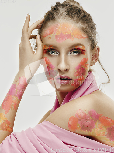 Image of Portrait of beautiful young woman with modern floral design, inspiration artwork. Fashion, beauty concept.