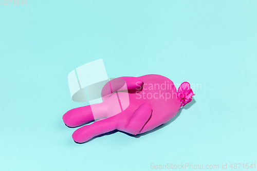 Image of Life of rubber glove like a person - protective wear isolated on blue studio background