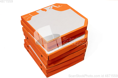 Image of Close up of carton orange boxes for pizza isolated on white studio background with copyspace