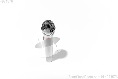 Image of Grey wireless microphone with shadow isolated on white studio background