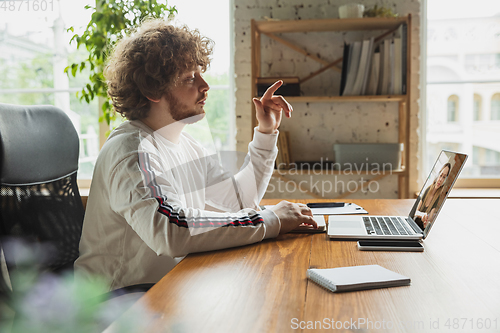 Image of Manager or student working from home while being insulated or keep quarantine \'cause of coronavirus COVID-19. Online conference, meeting.