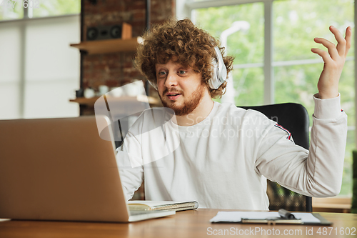 Image of Manager or student working from home while being insulated or keep quarantine \'cause of coronavirus COVID-19. Online meeting.