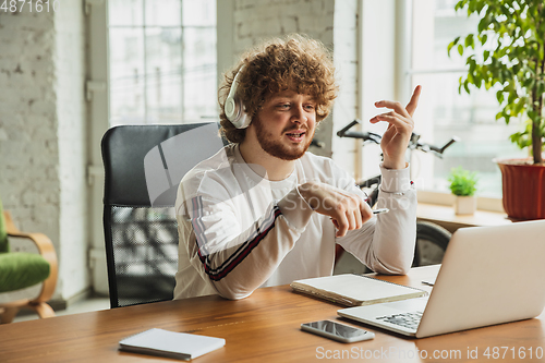 Image of Manager or student working from home while being insulated or keep quarantine \'cause of coronavirus COVID-19. Online conference, meeting.