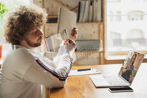 Image of Manager or student working from home while being insulated or keep quarantine \'cause of coronavirus COVID-19. Online conference, meeting.