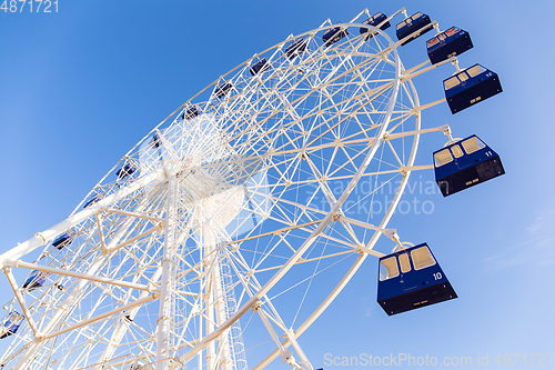 Image of Ferris wheel with blue sky