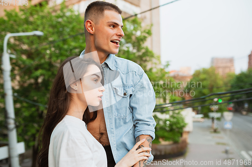 Image of Quarantine lockdown, stay home concept - young beautiful caucasian couple enjoying new lifestyle during coronavirus worldwide health emergency