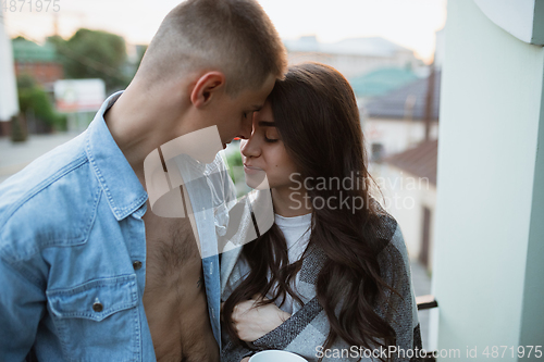 Image of Quarantine lockdown, stay home concept - young beautiful caucasian couple enjoying new lifestyle during coronavirus worldwide health emergency