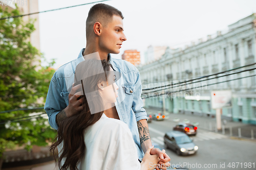 Image of Quarantine lockdown, stay home concept - young beautiful caucasian couple enjoying new lifestyle during coronavirus worldwide health emergency