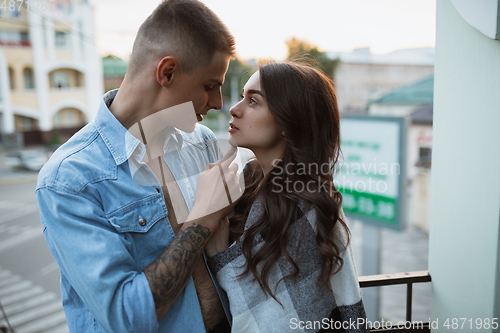 Image of Quarantine lockdown, stay home concept - young beautiful caucasian couple enjoying new lifestyle during coronavirus worldwide health emergency