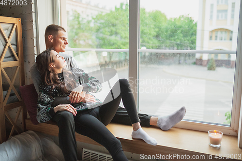 Image of Quarantine lockdown, stay home concept - young beautiful caucasian couple enjoying new lifestyle during coronavirus worldwide health emergency