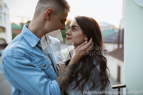 Image of Quarantine lockdown, stay home concept - young beautiful caucasian couple enjoying new lifestyle during coronavirus worldwide health emergency