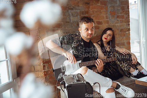 Image of Caucasian musicians during online concert at home insulated and quarantined, cheerful and happy, impressive improvising