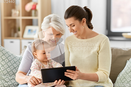 Image of mother, daughter and grandma with tablet pc