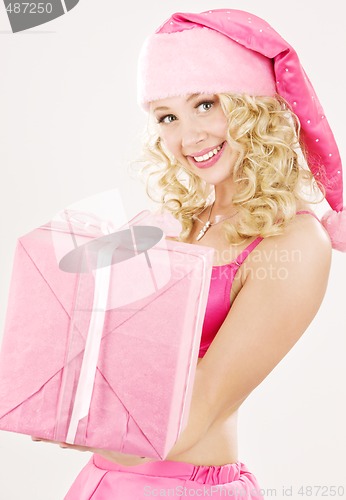 Image of cheerful santa helper girl with gift box