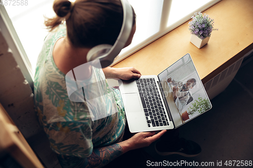 Image of Close up of young man getting online medical help and advice during videocall with doctor checking symtoms aand explaining the drug\'s reciepes