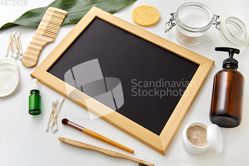 Image of natural cosmetics and chalkboard