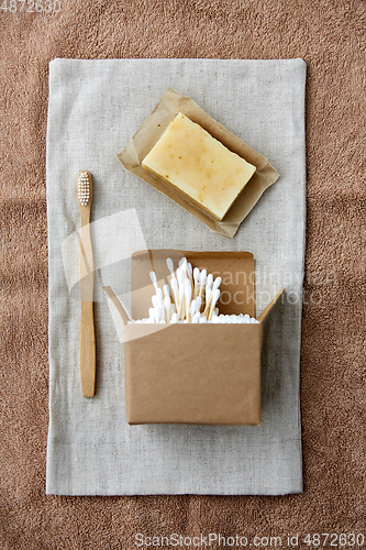 Image of wooden toothbrush, handmade soap cotton swabs