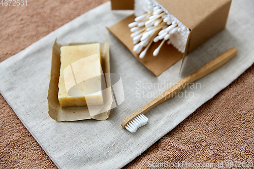 Image of wooden toothbrush, handmade soap cotton swabs