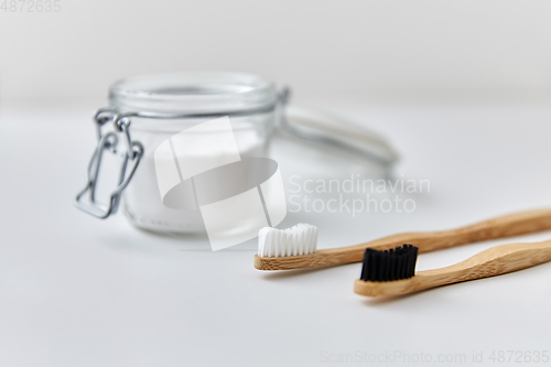 Image of washing soda and wooden toothbrushes