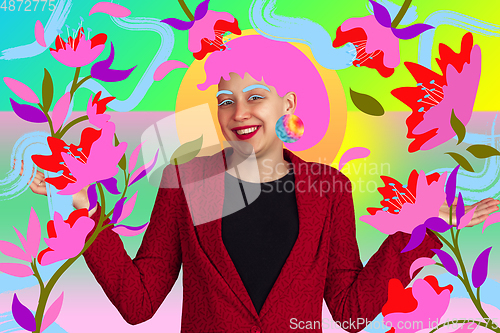 Image of Portrait of a young woman with freaky appearance, look and bright colorful painted design