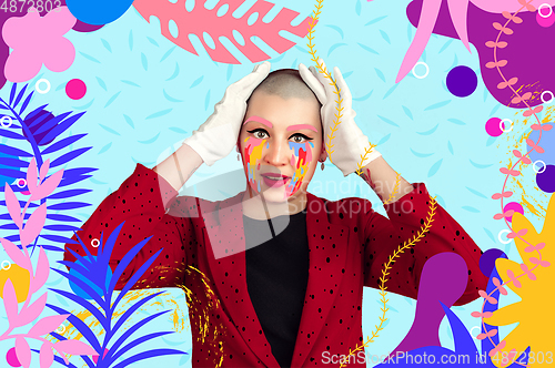 Image of Portrait of a young woman with freaky appearance, look and bright colorful painted design