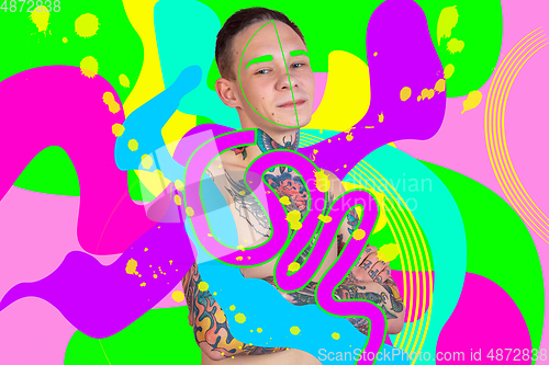 Image of Portrait of a young man with freaky appearance, look and bright colorful painted design