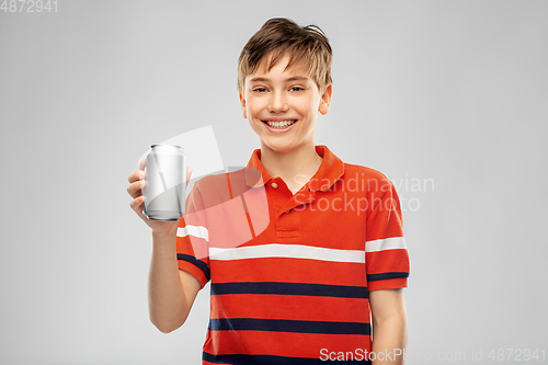 Image of happy smiling boy holding soda drink in tin can