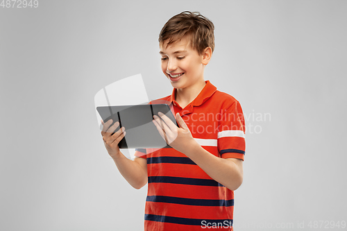 Image of happy smiling boy using tablet computer