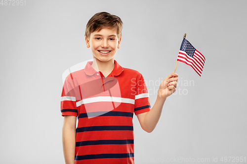 Image of portrait of happy smiling boy in red polo t-shirt